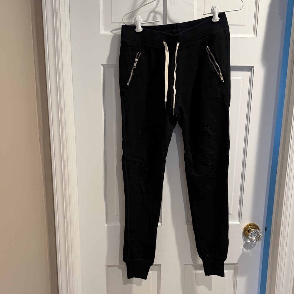 Philanthropy Black Sweatpants with zipper pockets and all over cut out details